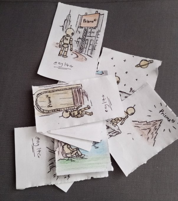 Several small hand-drawn sketches scattered on a dark surface, depicting astronauts, planets, and space scenes, with handwritten text including 'Prisma' and '14¢'.