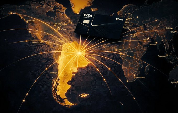 The image features a map of South America with a black credit card labeled "Visa" sitting next to it, surrounded by bright yellow lines representing the interconnectedness of countries across the globe. The text in the image reads "goodnight my wonderful Fam! the future of crypto is simple and useful and we are just moments away.. @useTria is the self-custodial neobank that combines trading, high yields, and real-world Visa spending in one app."