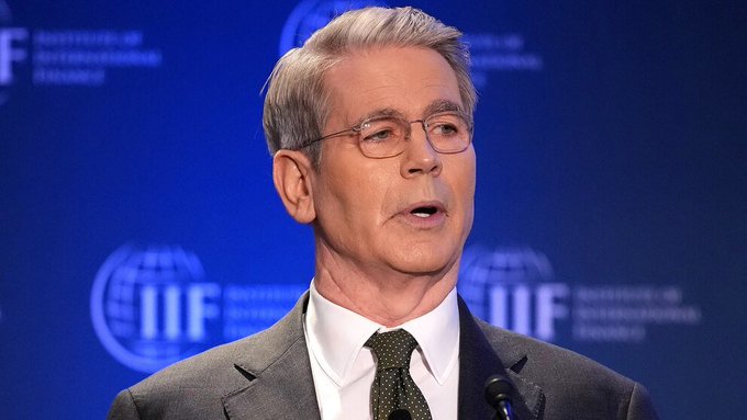 A man with gray hair, glasses, and a suit speaks at a podium, with the "IIF" (Institute of International Finance) logo visible in the background. The post's note about a typo from "COULD" to "WILL" suggests the speaker is delivering a strong, definitive statement—likely the Federal Reserve Chairman (Jerome Powell)—on a financial or economic topic.