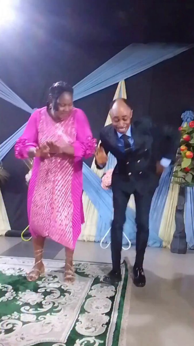 The image shows a man wearing a suit and tie dancing with a woman who is also dressed up, possibly at an event or party. They are both smiling as they dance together. The background of the photo features a stage setting with curtains, suggesting that this could be part of a performance or a special occasion.

The caption "Dai Dai no reach new peak today? We shall laugh accordingly in weeks to come" implies that there might have been an event where the man and woman were dancing together, but it is unclear if they reached a new personal best or achieved something significant at the time of the photo. The post suggests that this moment captured in the image could be seen as a milestone or achievement for both individuals involved.