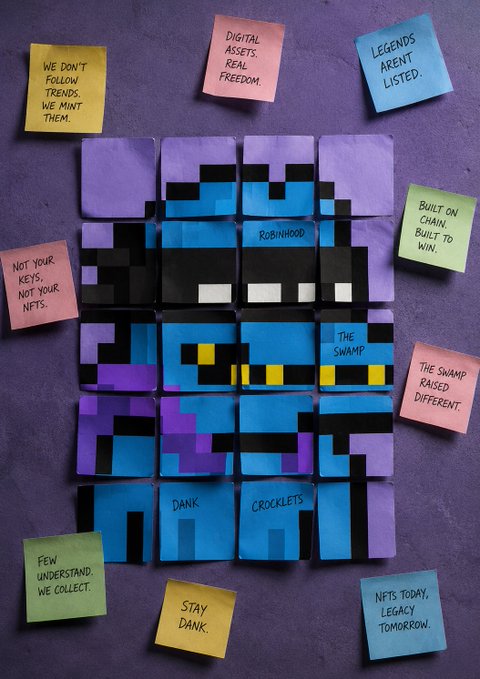 A display of pixel art blocks arranged on a purple surface, surrounded by colorful sticky notes with text including 'WE DON'T FOLLOW TRENDS, WE MINT THEM', 'DIGITAL ASSETS, REAL FREEDOM.', 'LEGENDS AREN'T LISTED.', 'BUILT ON CHAIN. BUILT TO WIN.', 'THE SWAMP RAISED DIFFERENT.', 'NFTS TODAY, LEGACY TOMORROW.', and labels like 'ROBINHOOD', 'THE SWAMP', 'DANK', and 'CROCKETS'.