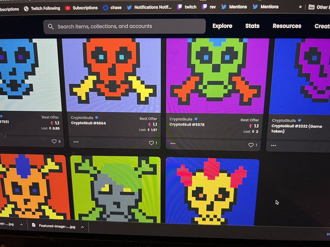 A photo of a computer screen displaying an NFT marketplace listing various pixel-art "Cryptoskulls" tokens with different best offers and prices visible.