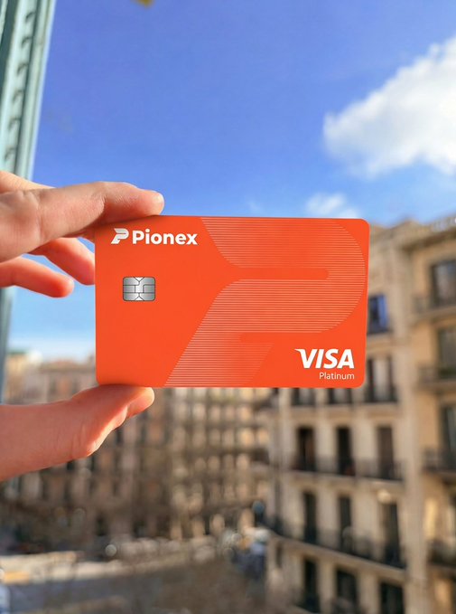 A hand holds up a vibrant orange Pionex Visa Platinum card against a cityscape backdrop with blue sky, embodying the post's greeting as a stylish "GM from PionexPay" invite to start the Monday with crypto-friendly payment possibilities.