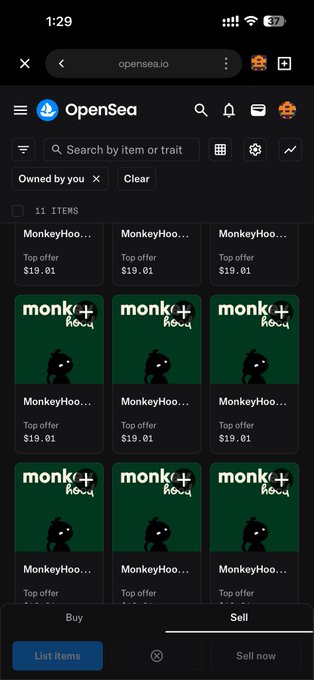 A screenshot of the OpenSea mobile app showing the user's collection of 11 'MonkeyHood' NFT items, each with a top offer of $19.01, displayed in a grid layout with the 'Sell' tab selected.