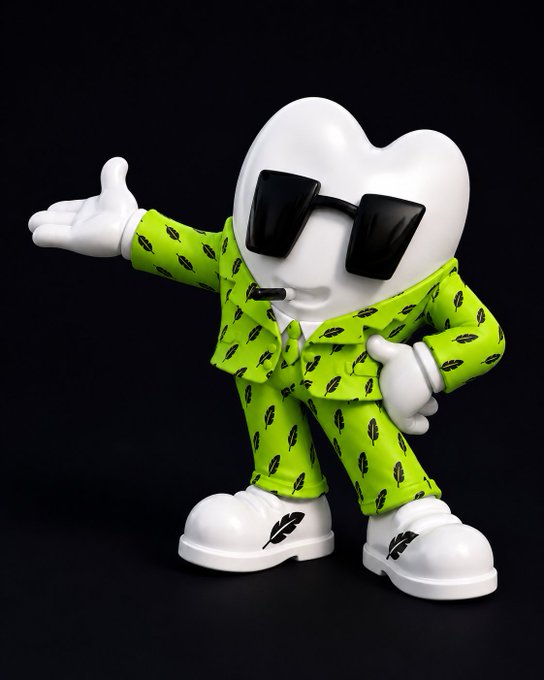 A 3D-rendered white character with a heart-shaped head wearing black sunglasses, a green patterned outfit, and white shoes, posing with one arm extended.