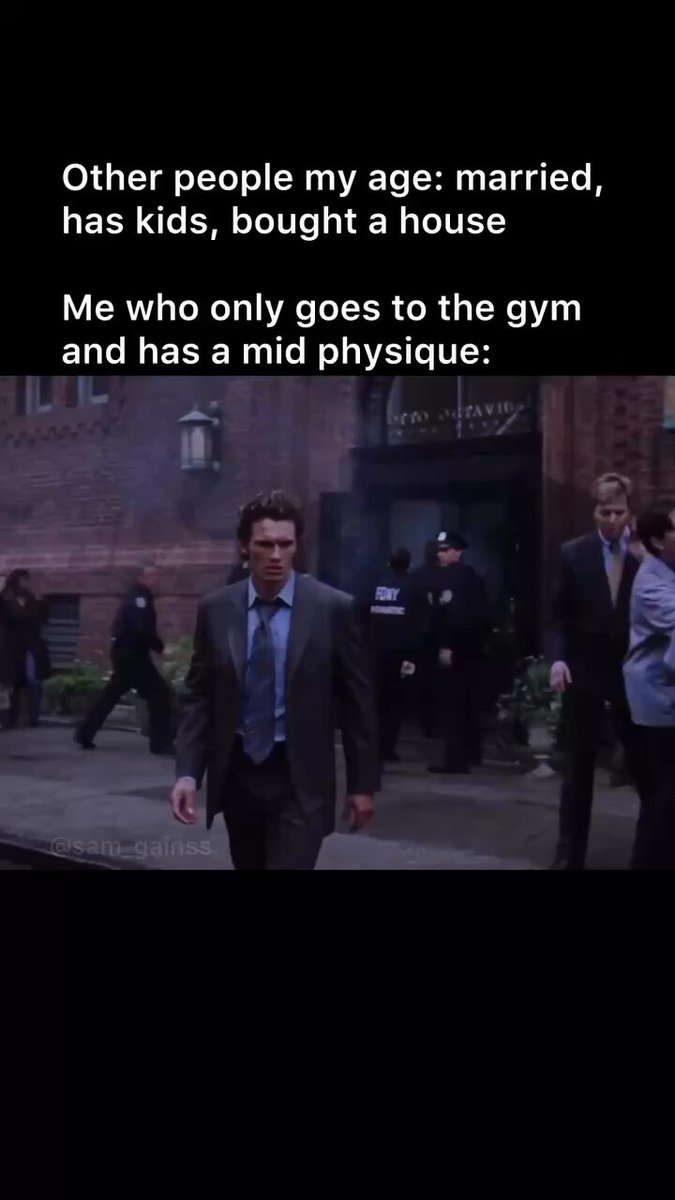 The image features a man dressed in a suit walking down a street, with other people visible around him. The caption of the image reads "Other people my age, married, has kids, bought a house. Me who only goes to the gym and has a mid-physique." This text is related to the post about the Wolfswapdotapp, which suggests that the man in the suit might be interested in fitness or health-related content on social media platforms like Instagram.