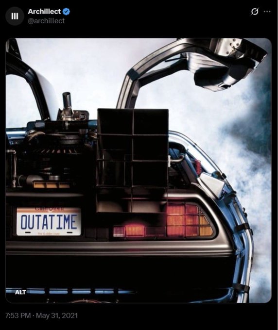 A rear view of the DeLorean from "Back to the Future," featuring its distinctive California license plate "OUTATIME," gull-wing doors, and mechanical components visible against a cloudy sky.