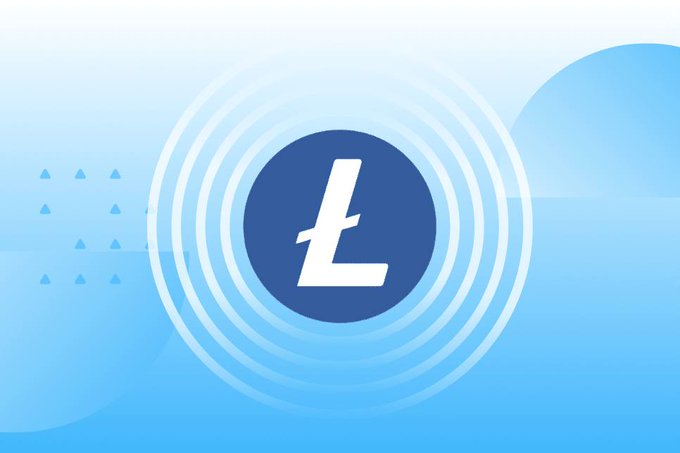 A graphic featuring the Litecoin ($LTC) logo—a stylized white "L" inside a dark blue circle, surrounded by glowing concentric rings—set against a soft blue gradient background with subtle triangular accents. The bold, centered design reinforces the post's message that Litecoin remains a recognizable and enduring name in crypto.
