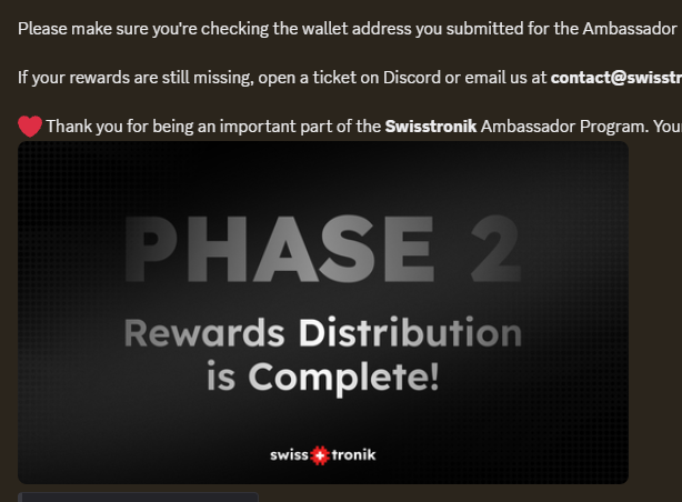 A notification from Swisstronik announcing that 'PHASE 2 Rewards Distribution is Complete!' for their Ambassador Program, with instructions to verify wallet addresses and contact support via Discord or email.