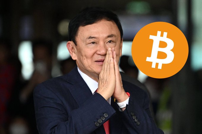 A man in a dark suit stands with his hands pressed together in a traditional Thai gesture of respect, accompanied by an orange Bitcoin (₿) logo overlay. The image illustrates the accompanying post about former Thailand Prime Minister Thaksin Shinawatra predicting Bitcoin will soar to $850,000.