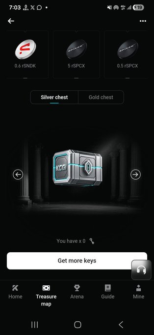 A mobile game interface showing a "Silver chest" on a "Treasure map" screen with KCGI keys, displaying rewards like 0.6 rSNDK, 5 rSPCX, and 0.5 rSPCX, with a "Get more keys" button.