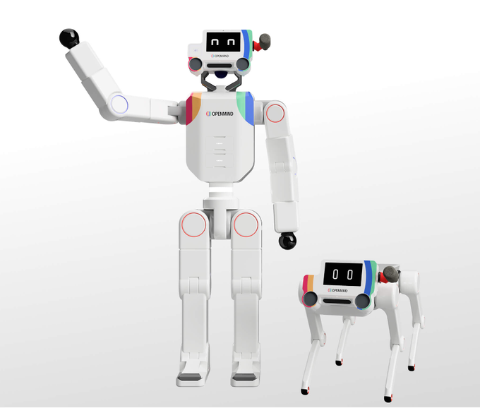 The image displays a white humanoid robot and a smaller quadruped robot, both with "OPENMIND" branding and digital displays showing "00" on their faces, representing the robotic ecosystem described in the post about OpenMind using Pi cryptocurrency for RoboPay services. The futuristic robots visually symbolize the integration of AI robotics with decentralized payment technology, illustrating the sci-fi-like concept becoming reality mentioned in the text.