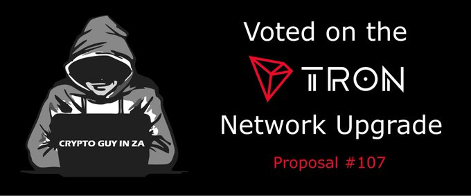 A graphic reading 'Voted on the TRON Network Upgrade, Proposal #107' alongside a hooded hacker character labeled 'CRYPTO GUY IN ZA'.