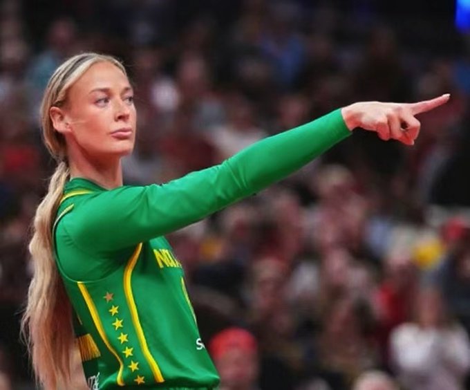 A blonde female athlete in a green jersey points accusingly toward the camera, matching the meme's theme of a girlfriend catching her partner in a lie about buying Bitcoin on MGBX.