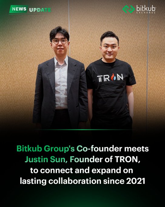 The image shows a "News Update" graphic from Bitkub Exchange featuring two men posing together: one in a dark suit and another wearing a black TRON-branded t-shirt. The caption reads "Bitkub Group's Co-founder meets Justin Sun, Founder of TRON, to connect and expand on lasting collaboration since 2021," which aligns with the accompanying post about Atthakrit Chimplapibul (K) meeting with Justin Sun at TOKEN2049 in Singapore to discuss their ongoing partnership.