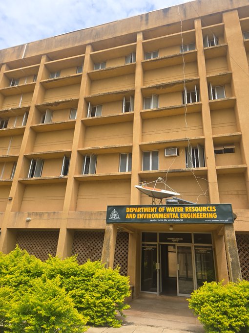 A multi-story tan building housing the 'Department of Water Resources and Environmental Engineering' with a small boat model mounted above the entrance.