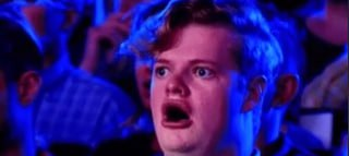 A young man with a shocked, wide-eyed expression appears on what looks like a talent show, with the post humorously comparing his stunned face to the feeling of seeing a green stock market arrow and instantly calculating generational wealth.