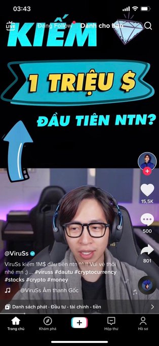 A TikTok thumbnail by user @ViruSs showing a young man with glasses and headphones, with bold Vietnamese text reading "KIẾM 1 TRIỆU $ ĐẦU TIÊN NTN?" (How to make your first $1 million?) alongside a large dollar bag graphic and hashtags #viruss #dautu #cryptocurrency #stocks #crypto #money. The image, with its 15.5K likes and focus on making millions through crypto, serves as a fitting visual for the caption about NFT game era controversies and influencers potentially being owners of hyped projects.