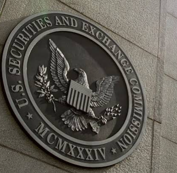 A metallic seal of the U.S. Securities and Exchange Commission mounted on a stone wall, featuring an eagle and the Roman numerals "MCMXXXIV."