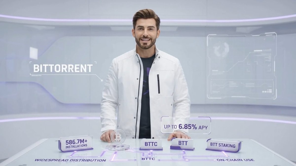 A man in a white jacket standing in a futuristic studio presenting 'BITTORRENT' with floating displays showing 'UP TO 6.85% APY', '586.7M+ INSTALLATIONS', and sections for BTTC, BTT, and BTT STAKING.