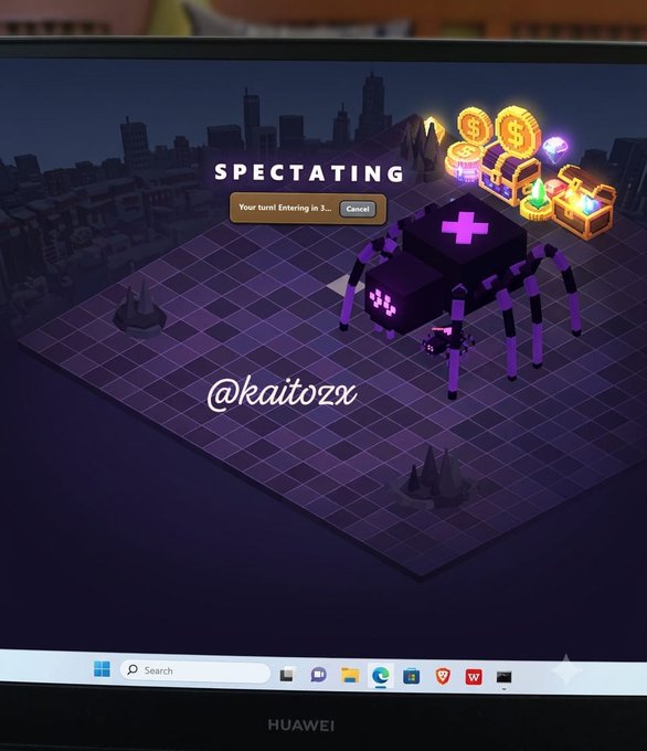 A screenshot of a computer monitor displaying a video game with a 'SPECTATING' message and a purple spider-like creature on a grid, with the watermark '@kaitozx' visible.