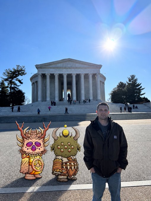 A man stands in front of the Jefferson Memorial in Washington D.C., with two cartoon-style fantasy characters edited into the foreground.
