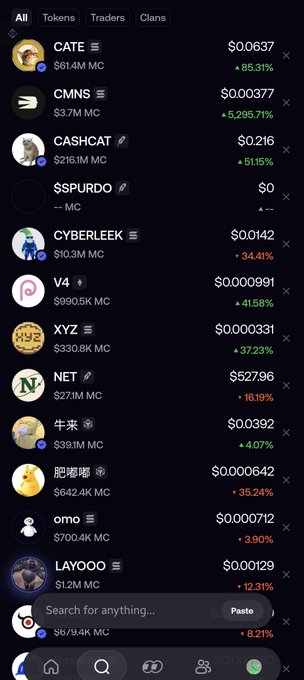 A cryptocurrency trading app displaying a list of tokens with their prices, market caps, and percentage changes, including CATE ($0.0637, +85.31%), CMNS ($0.00377, +5,295.7%), CASHCAT ($0.216, +51.5%), $SPURDO ($0), CYBERLEEK ($0.0142, +34.41%), V4 ($0.000991, +41.58%), XYZ ($0.000331, +37.23%), NET ($527.96, -16.19%), 牛来 ($0.0392, +4.07%), 肥嘟嘟 ($0.000642, +35.24%), omo ($0.000712, +3.90%), LAYOOO ($0.000129, +12.31%), and G... ($0.0, -8.21%).