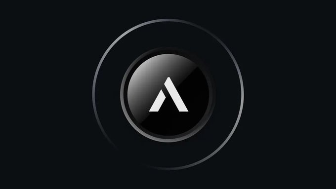 A minimalist logo featuring a white 'A' inside a glossy black circle, surrounded by concentric rings on a dark background.