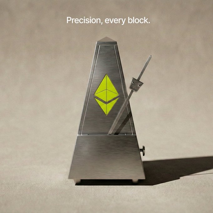 The image features a small, silver electronic device with an unusual design that resembles a musical instrument or a clock. It has a yellow triangle at its center, which stands out against the silver body of the device. The device appears to be made of metal, giving it a unique and modern look. The post includes text that reads "Precision, every block." This phrase is related to the concept of blockchain technology, which is often associated with cryptocurrencies like Bitcoin.