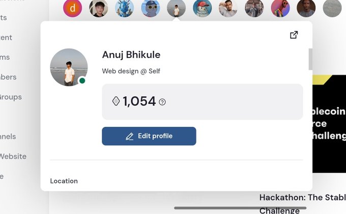 A user profile card for "Anuj Bhikule," a self-employed web designer with 1,054 views, is displayed against a partial background mentioning a "Hackathon: The Stab[lecoin]... Challenge," suggesting participation in a blockchain-related hackathon.