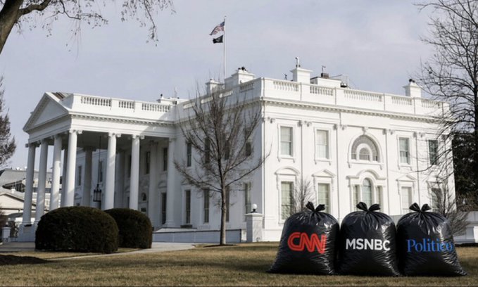 An AI-generated image shared by President Trump on TruthSocial shows the White House with three large black trash bags outside, labeled with the logos of CNN, MSNBC, and Politico—symbolizing his decision to bar these news outlets from the White House.