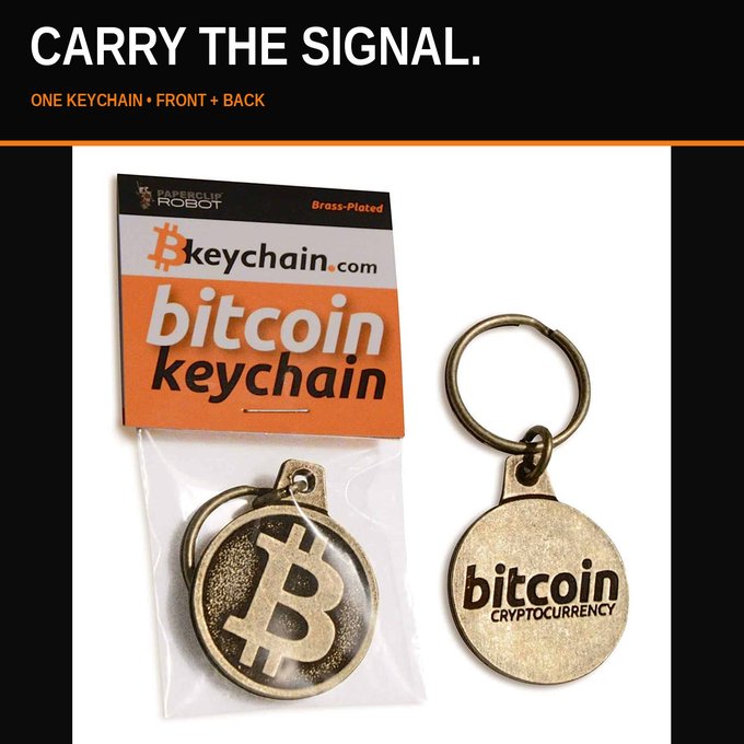 A product image shows a brass-plated Bitcoin keychain from Brasskey Robot with text 'CARRY THE SIGNAL.' and 'ONE KEYCHAIN + FRONT + BACK' displayed on the packaging.