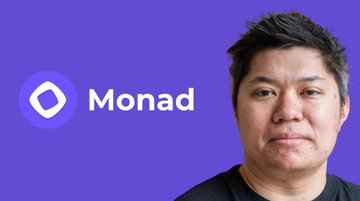 urn of purple and white text reading "MONAD" is centered against a light blue background, with the person's face partially visible above it.