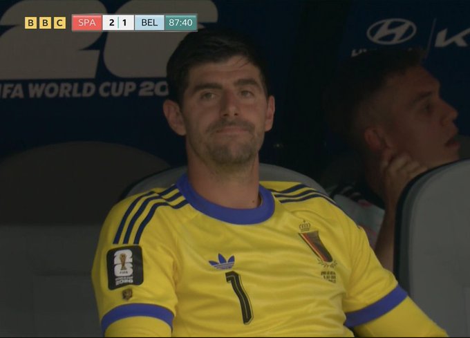 A BBC broadcast showing Belgium goalkeeper Thibaut Courtois wearing a yellow #1 jersey with a Belgium crest, during a World Cup match against Spain (SPA 2-1 BEL) at 87:40.