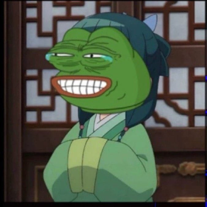 An animated meme image showing a green-skinned character with a wide, forced smile and tears, wearing a green traditional robe and blue hair, standing in front of a wooden lattice background.