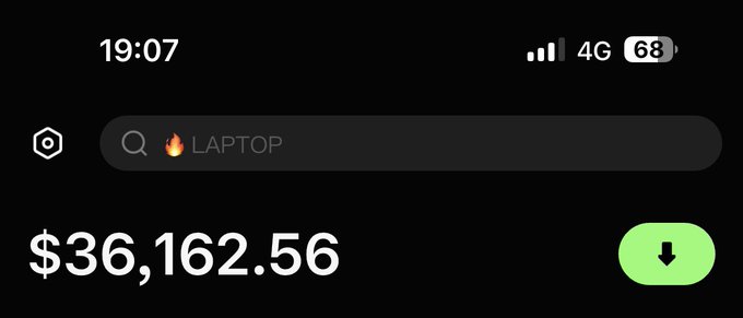 A mobile screenshot showing a cryptocurrency app with the search bar displaying "🔥 LAPTOP" and a balance of $36,162.56.