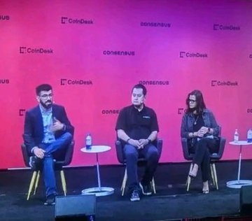 A panel discussion at Consensus 2024 featuring three speakers on a stage with CoinDesk and CoinDesk-branded backdrop. According to the post, the discussion centers on RISC-V and blockchain technology being crucial for open-source, energy-efficient chip production in the AI era.