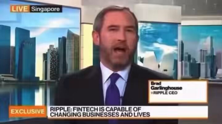 The image features a man wearing a suit, talking about Ripple cryptocurrency on television. The man appears to be discussing the potential of Ripple as a game-changing technology for real customers at scale. The text "Focus on what is in the image" suggests that the viewer should pay attention to the content being displayed and consider how it connects with the post's message.