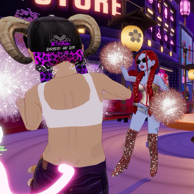 The image shows a woman with purple hair, wearing a black hat and boots, standing next to another woman who is also wearing a purple hat and boots but has red hair. They are both holding pom-poms or fireworks, which appear to be set off in the background of the scene. The post about SkatLionrock setting fire seems unrelated to this image, as it does not provide any context or information about the characters' appearances or actions.
The caption "Quiet day in the plaza... nope @SkatLionrock has set the place on fire. DRIP Or DIE in @decentraland" is a bit confusing and unrelated to the image, as it does not provide any relevant details about the scene depicted in the picture. 
The focus of the caption should be on the image itself or the post that features the SkatLionrock character setting fire.