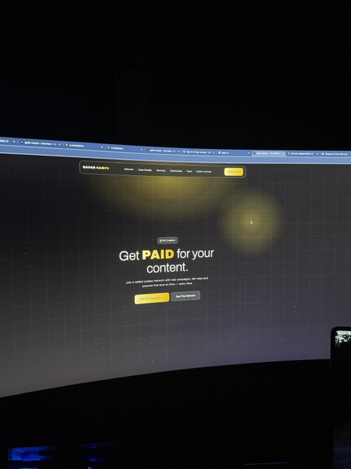 The image shows a curved monitor displaying the KARMA KARTS website with the headline "Get PAID for your content," suggesting a content creator platform. This setup is being prepared for a "Live soon" broadcast, likely promoting opportunities for creators to monetize their content on the Karma Karts platform.