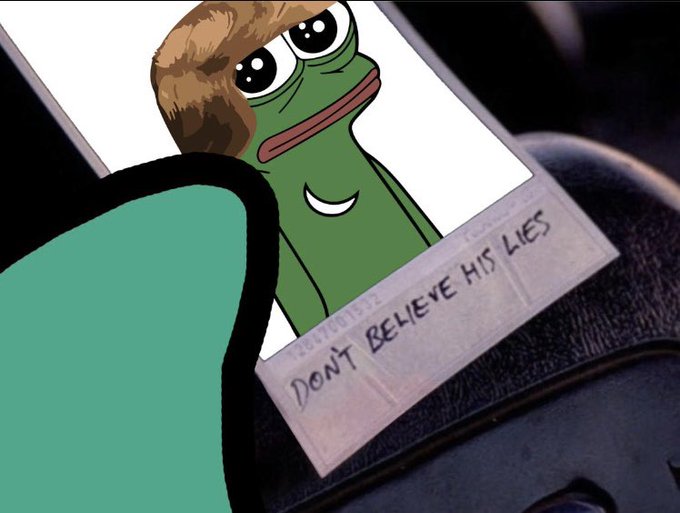 A cartoon frog with brown hair and a pink tongue, wearing a green hat, sits on a black surface with the text "Don't believe his lies" above it.