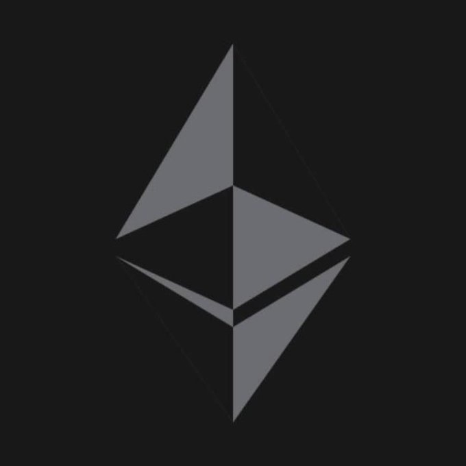 The Ethereum cryptocurrency logo, depicted as a gray geometric octahedron design on a black background.