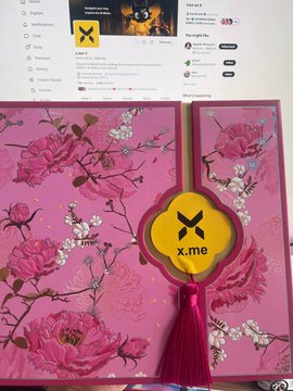 A pink floral gift box with "x.me" branding and a tassel sits open on a desk in front of a laptop displaying a YouTube channel page for "Langtu tắt cờ Việt Nam," representing the Mid-Autumn Festival gifts received from x.me and COCOteamvnn.