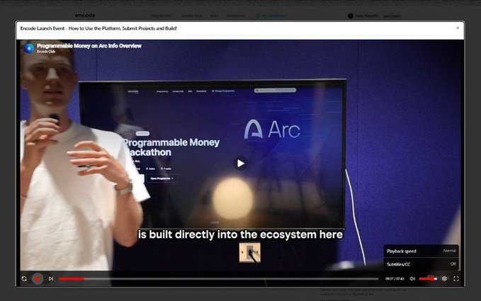 A video player showing an Encode Launch Event about Arc and the Programmable Money Hackathon, with a man in a white shirt speaking in front of a large screen.