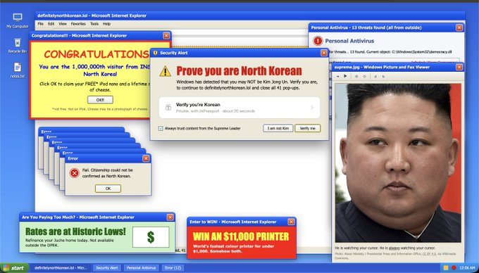 A Windows XP desktop is cluttered with pop-up windows declaring the user a "1,000,000th visitor from [INDIA]" and demanding they "Prove you are North Korean" before proceeding, alongside an image of Kim Jong-un captioned "He is watching your cursor." The image satirizes the exclusionary nature of geographic and identity-based verification systems, highlighting the absurdity of building technology that locks out entire populations like North Korea while claiming to serve the marginalized.