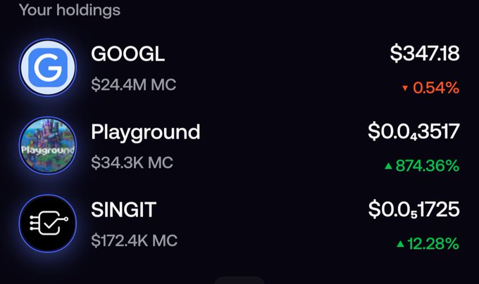 A cryptocurrency holdings screen showing GOOGL at $347.18 (-0.54%), Playground at $0.03517 (+874.36%), and SINGIT at $0.01725 (+12.28%).