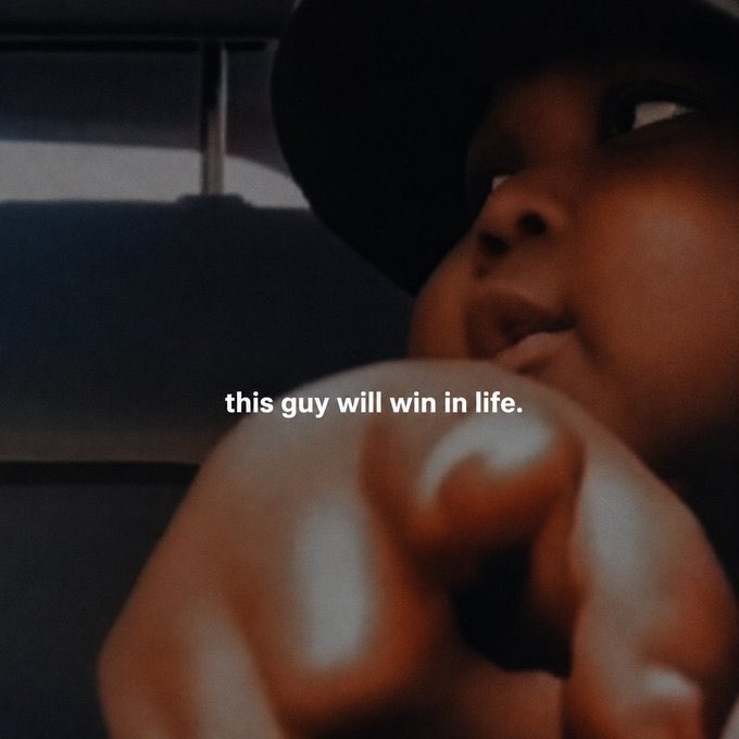 A close-up photo of a person looking at the camera with text overlay reading 'this guy will win in life.'