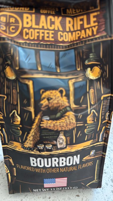 A package of Black Rifle Coffee Company Bourbon flavored coffee, featuring an illustrated bear in military-style gear on the front.