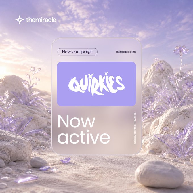 The image features a purple square sticker with white text, which reads "Quirkies" and "now active", placed on top of a rock formation or mountain landscape. The background includes rocks and flowers, creating an outdoor setting that complements the design of the sticker. The phrase "now active" suggests that the Quirkies campaign is in progress and actively engaging with users to promote self-expression, identity, and internet culture.