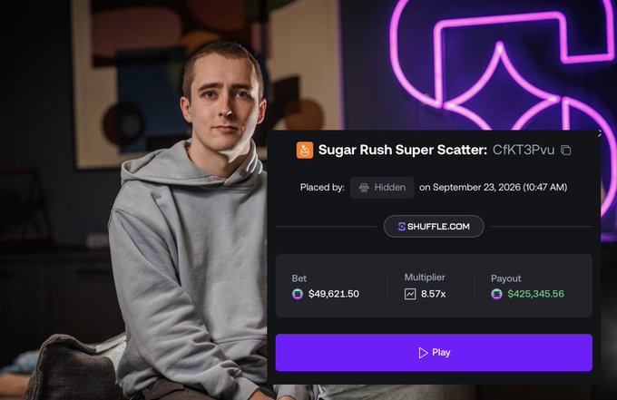 A young man in a gray hoodie sits in a room with neon lighting, with an overlay showing a 'Sugar Rush Super Scatter' gambling screen featuring a $49,621.50 bet with an 8.57x multiplier and a $425,345.56 payout on Shuffle.com.
